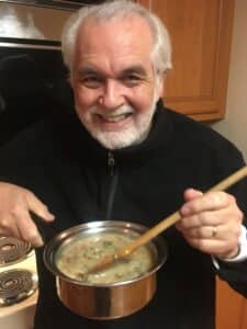 picture of George Marriner Maull cooking in one of the pots that he won on the show The Price is Right.