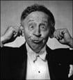 picture of Rubinstein pulling on his ears and making a funny face