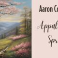 nice spring image with green grass, rolling hills, and a brook to represent Aaron Copland's Appalacian Spring.