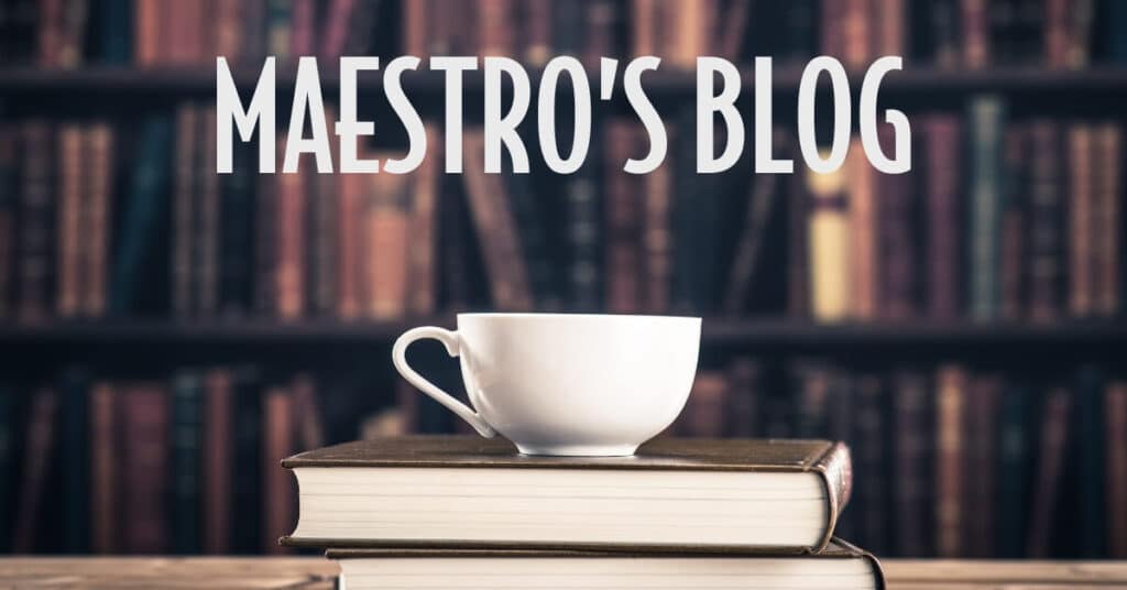 image of lots of books with a cup of coffee and the title is Maestro's