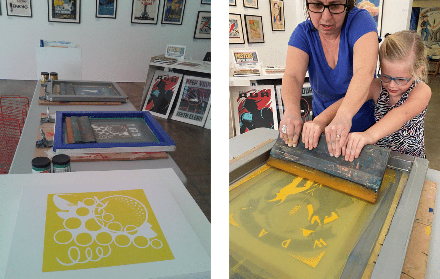picture of Ennis Carter, curator for Posters for the People with a little girl as they both are making a poster using a screen printer
